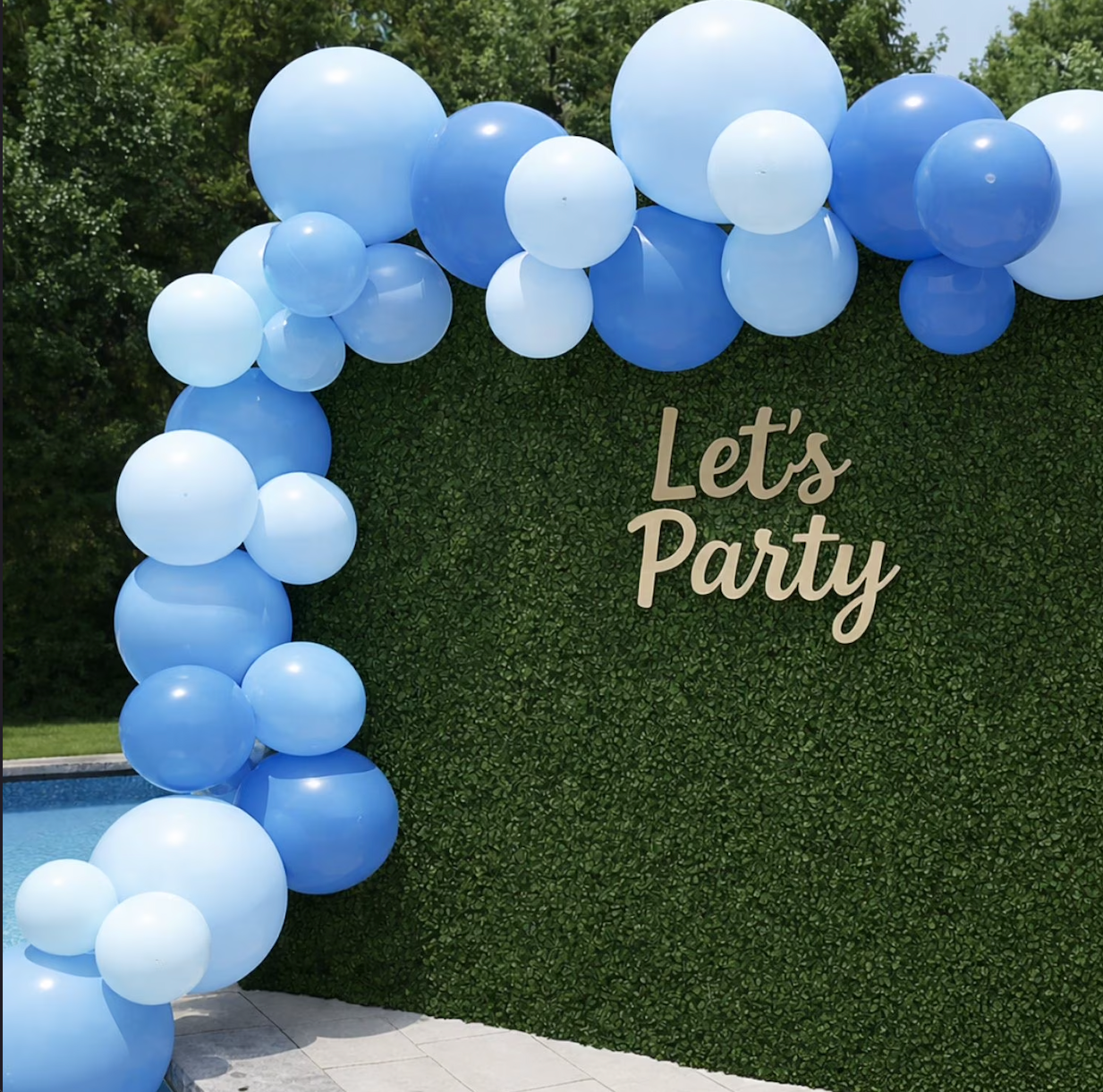 Blueberry Pop Balloon Arch Backdrop | Outdoor Party Setup | Party For Less Rentals Aurora Denver CO Blueberry Pop reusable blue balloon arch installed as a party backdrop against a green hedge wall – Party For Less Rentals in Aurora and Denver Colorado