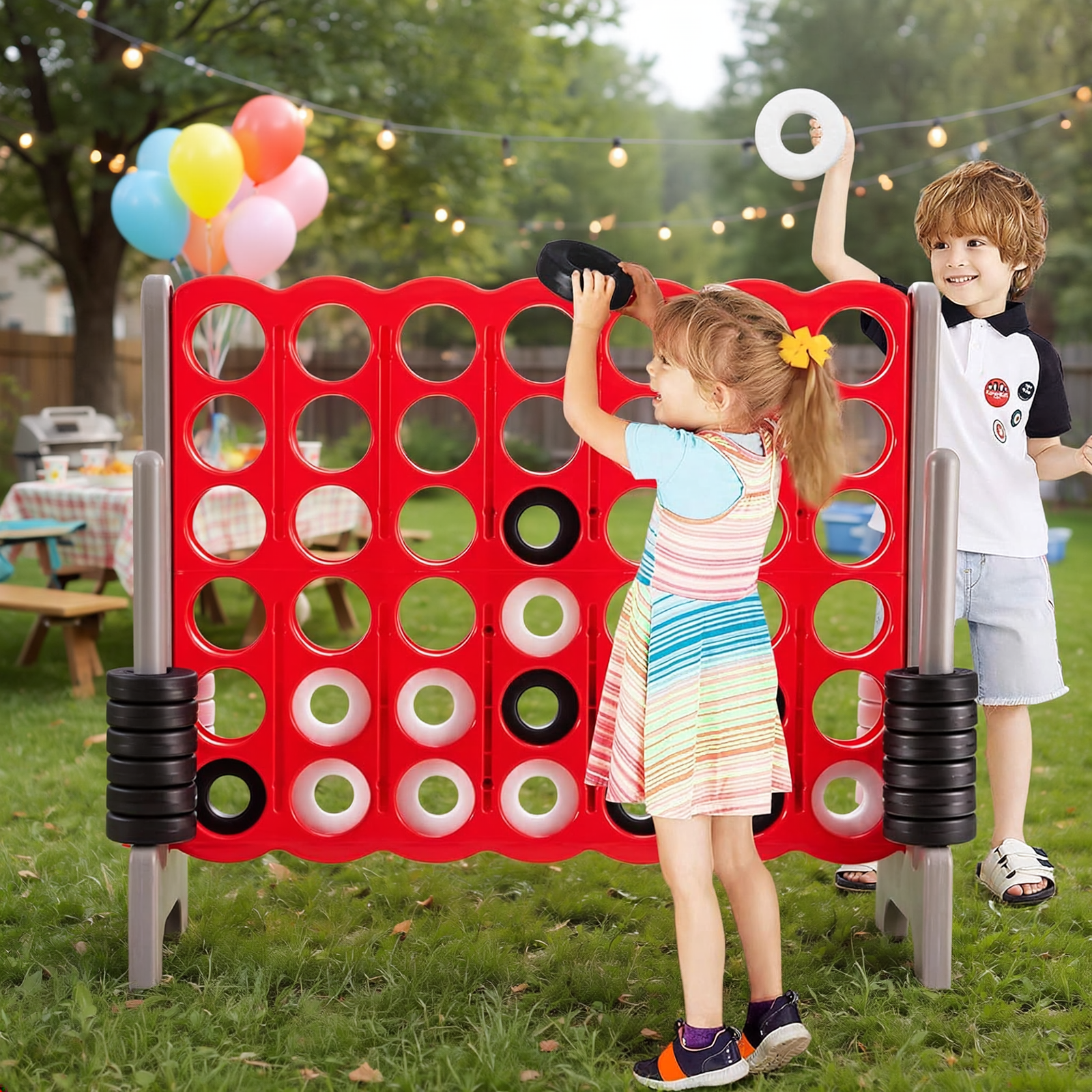 Giant 4-in-A-Row Game for Kids Backyard Parties | Party For Less Rentals Aurora Denver CO Party For Less Rentals giant 4-in-a-row jumbo game kids playing in backyard party Aurora Denver Colorado