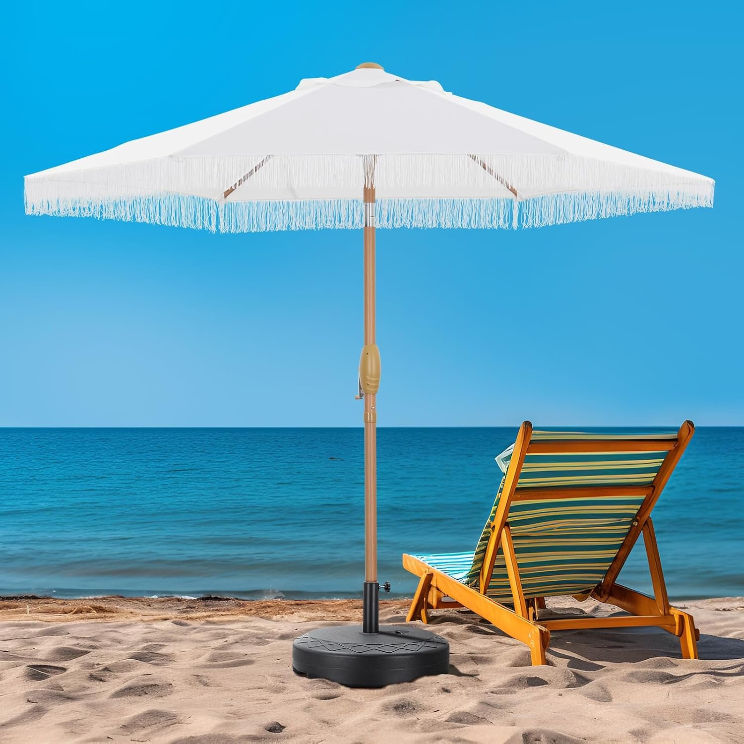 7.5 FT White Tassel Patio Umbrella Beach Setup | Party For Less Rentals Aurora Denver CO White 7.5 FT tassel fringe patio umbrella on the beach with lounge chair – stylish seaside shade by Party For Less Rentals in Aurora and Denver Colorado
